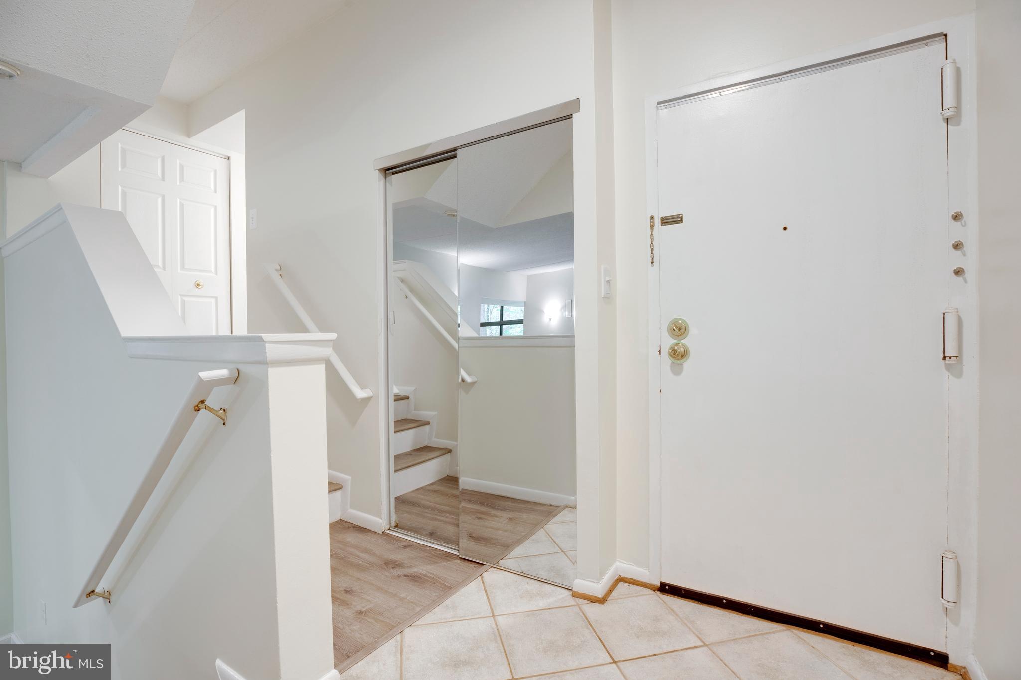 2106 Green Watch Way, Unit 101 Reston, VA 20191 - Photo 4 of 40 a view of an entryway with wooden floor