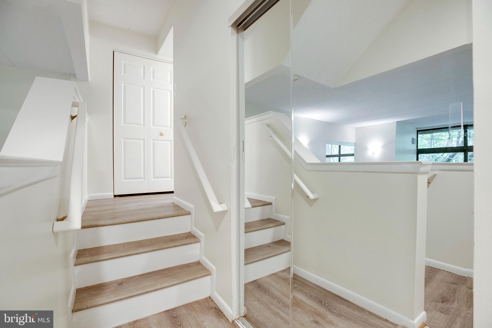 2106 Green Watch Way, Unit 101 Reston, VA 20191 - Photo 5 of 40 a view of entryway and hall with wooden floor