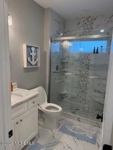 a bedroom with bed and wooden floor