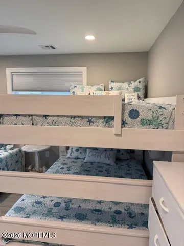 a bedroom with a bed and a fireplace