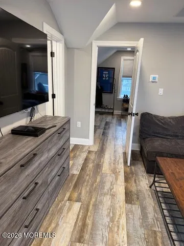 a bedroom with a bed and a view of bedroom