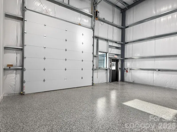 a view of storage and utility room with empty racks