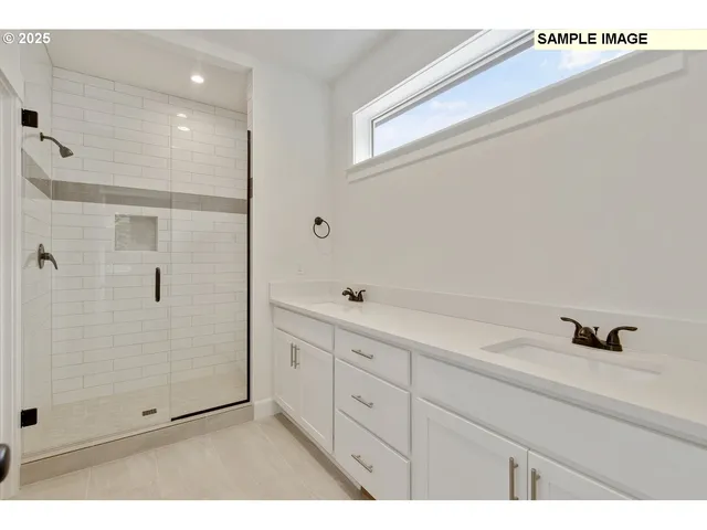 a bathroom with a shower sink and mirror