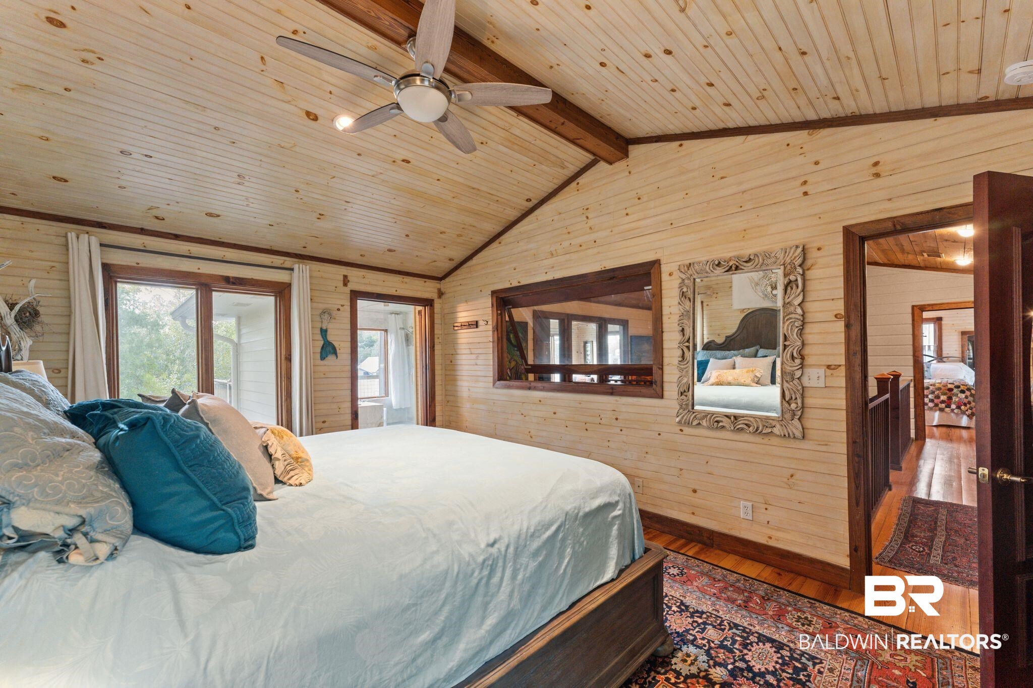 16451 Honey Road Summerdale, AL 36580 - Photo 35 of 55 Bedroom with hardwood / wood-style floors, wood walls, access to exterior, french doors, and ceiling fan