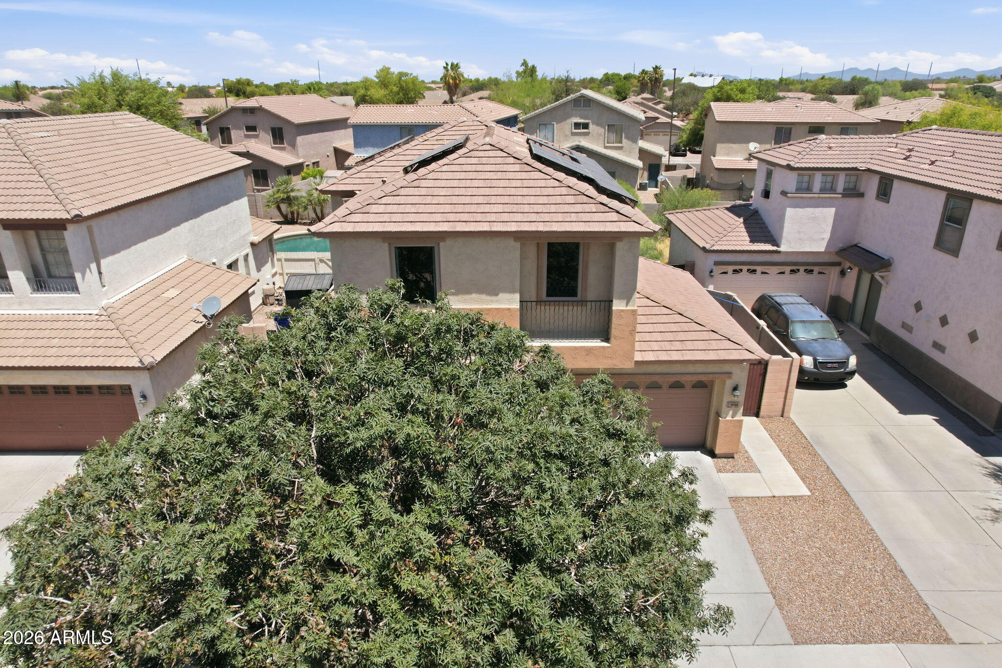 4184 East Trigger Way Gilbert, AZ 85297 - Photo 43 of 51 an aerial view of a house with a yard and balcony