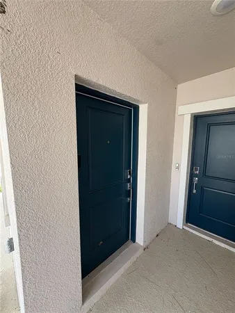 a view of hallway with closet and wooden floor