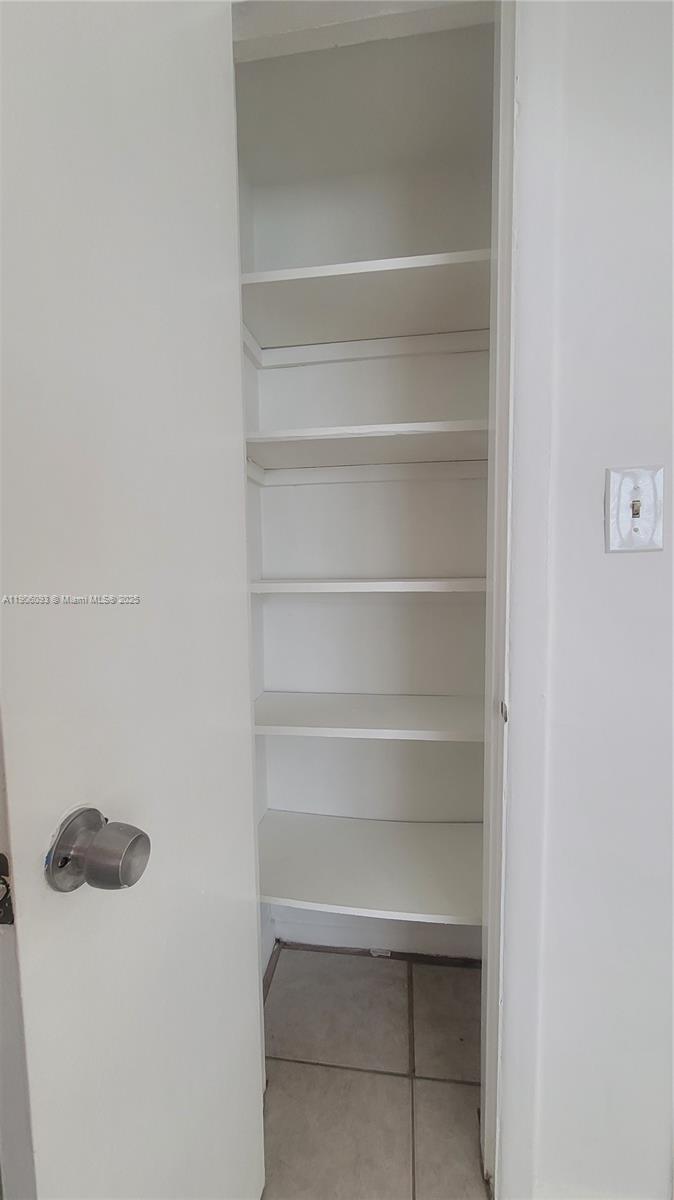 2601 Southwest 22nd Avenue, Unit 9 Miami, FL 33133 - Photo 11 of 15 a view of walk in closet with empty racks