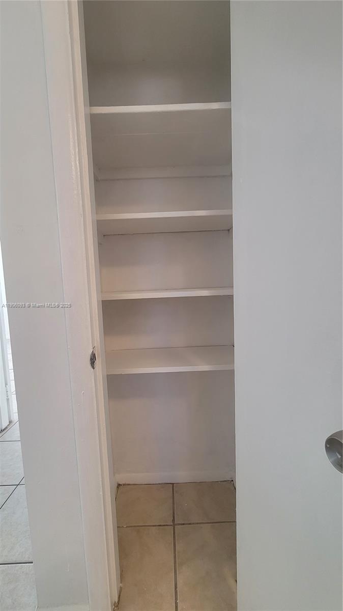 2601 Southwest 22nd Avenue, Unit 9 Miami, FL 33133 - Photo 7 of 15 a view of walk in closet with empty racks