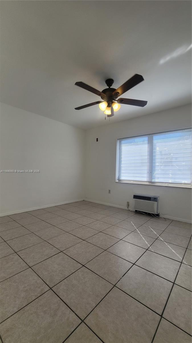 2601 Southwest 22nd Avenue, Unit 9 Miami, FL 33133 - Photo 8 of 15 a view of an empty room with a window