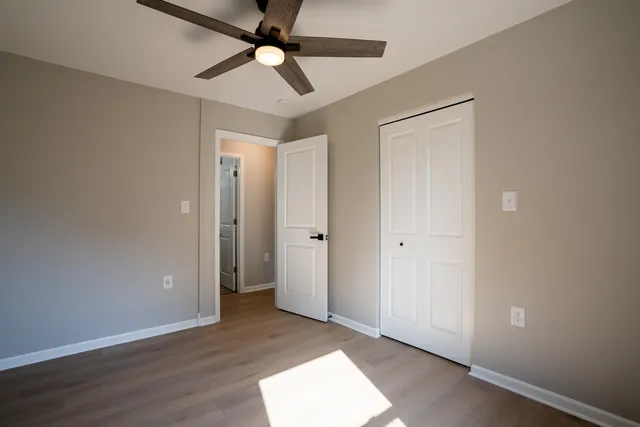 a view of an empty room and wooden floor