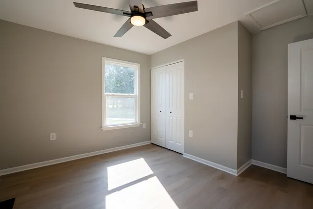 a view of an empty room with a window