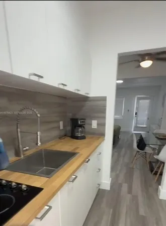 a kitchen with a sink and a stove