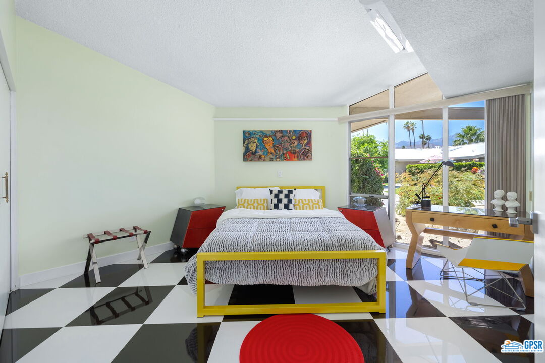 37800 Da Vall Drive, Unit 9 Rancho Mirage, CA 92270 - Photo 20 of 24 a bed sitting in a bedroom next to a window