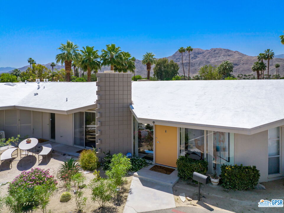 37800 Da Vall Drive, Unit 9 Rancho Mirage, CA 92270 - Photo 2 of 24 a view of a patio with table and chairs and potted plants