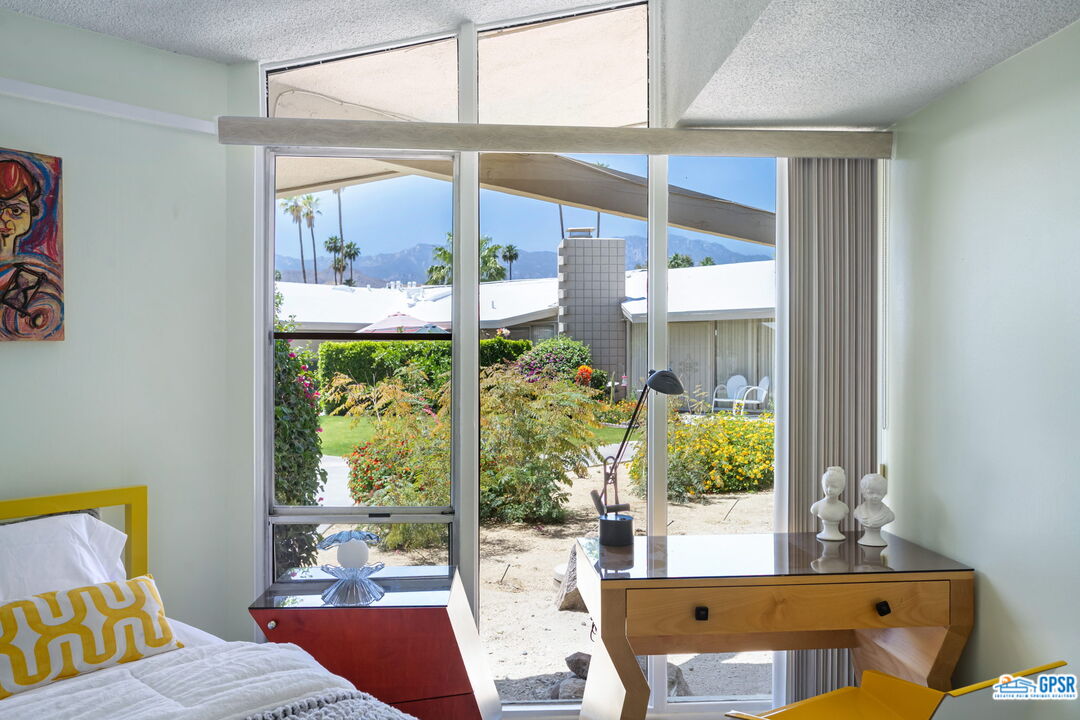 37800 Da Vall Drive, Unit 9 Rancho Mirage, CA 92270 - Photo 21 of 24 a view of a living room and a window