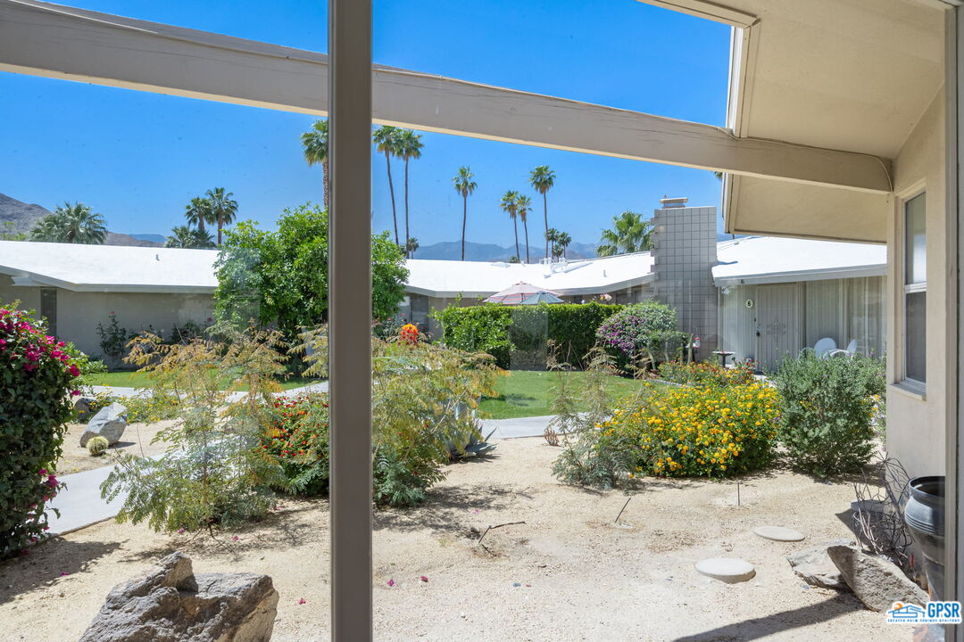 37800 Da Vall Drive, Unit 9 Rancho Mirage, CA 92270 - Photo 23 of 24 a view of a patio with plants and flowers