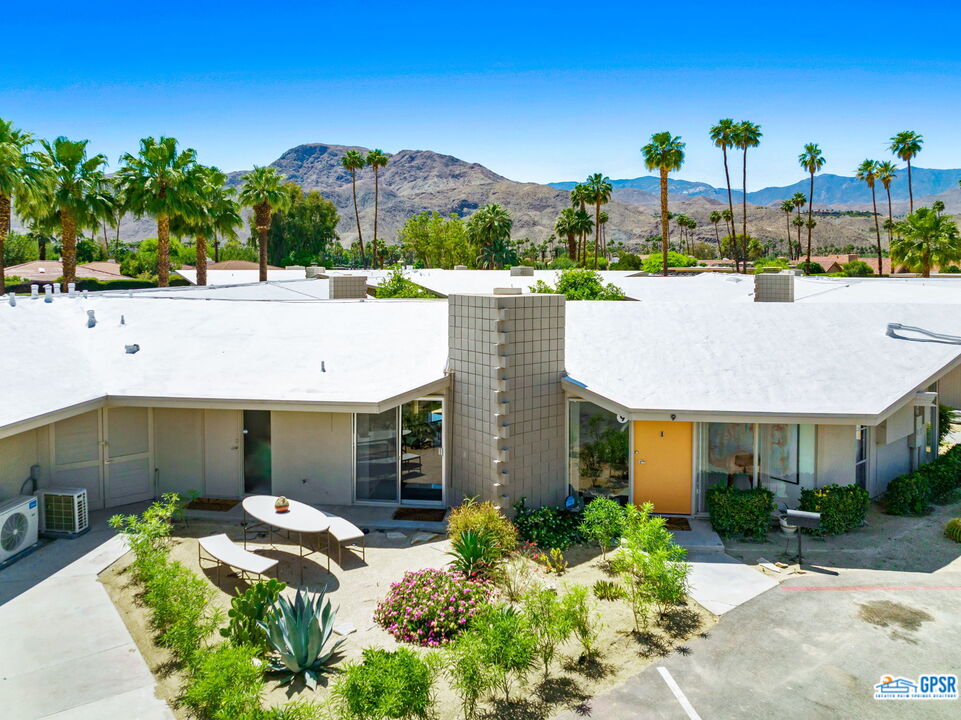 37800 Da Vall Drive, Unit 9 Rancho Mirage, CA 92270 - Photo 4 of 24 a front view of a house with garden and plants