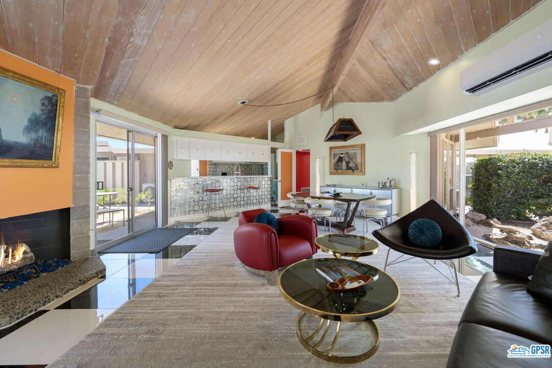 37800 Da Vall Drive, Unit 9 Rancho Mirage, CA 92270 - Photo 6 of 24 a living room with furniture and a fireplace