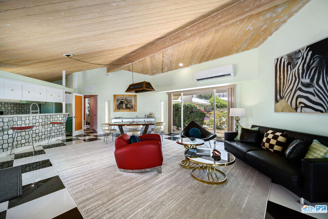 37800 Da Vall Drive, Unit 9 Rancho Mirage, CA 92270 - Photo 7 of 24 a living room with furniture and a wooden floor