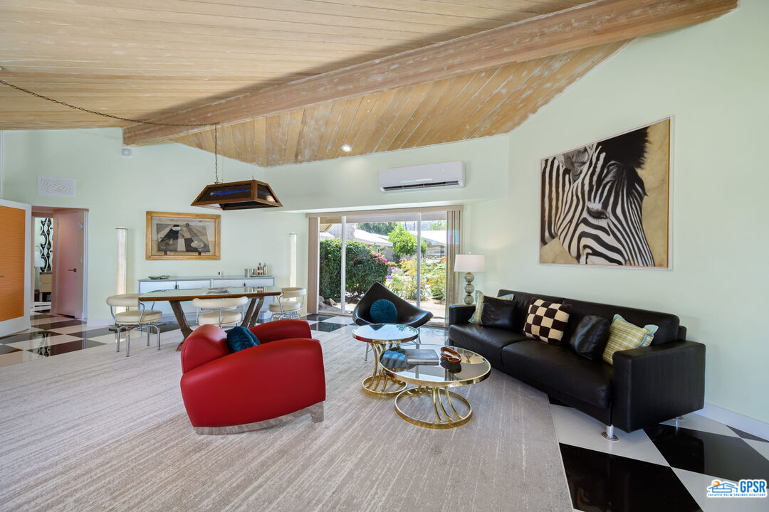 37800 Da Vall Drive, Unit 9 Rancho Mirage, CA 92270 - Photo 8 of 24 a living room with furniture and a wooden floor