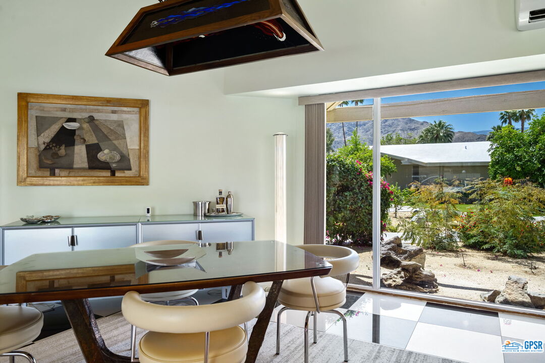 37800 Da Vall Drive, Unit 9 Rancho Mirage, CA 92270 - Photo 10 of 24 a view of a dining room with furniture window and outside view