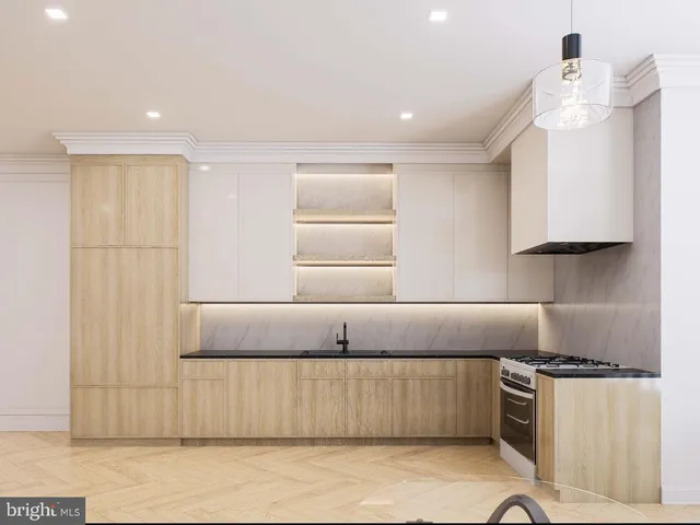 a kitchen with a stove a sink and a refrigerator