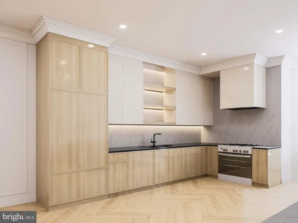a kitchen with stainless steel appliances granite countertop a refrigerator a sink and a stove