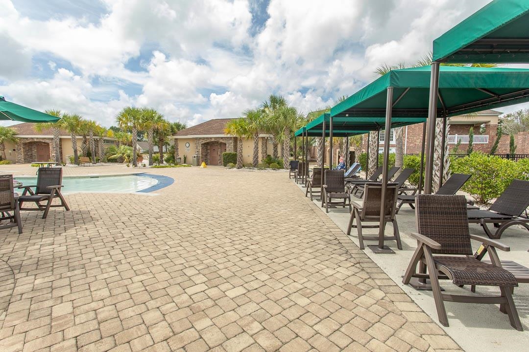 4348 Livorn Loop, Unit 41 Myrtle Beach, SC 29579 - Photo 25 of 30 Community pool featuring a patio area