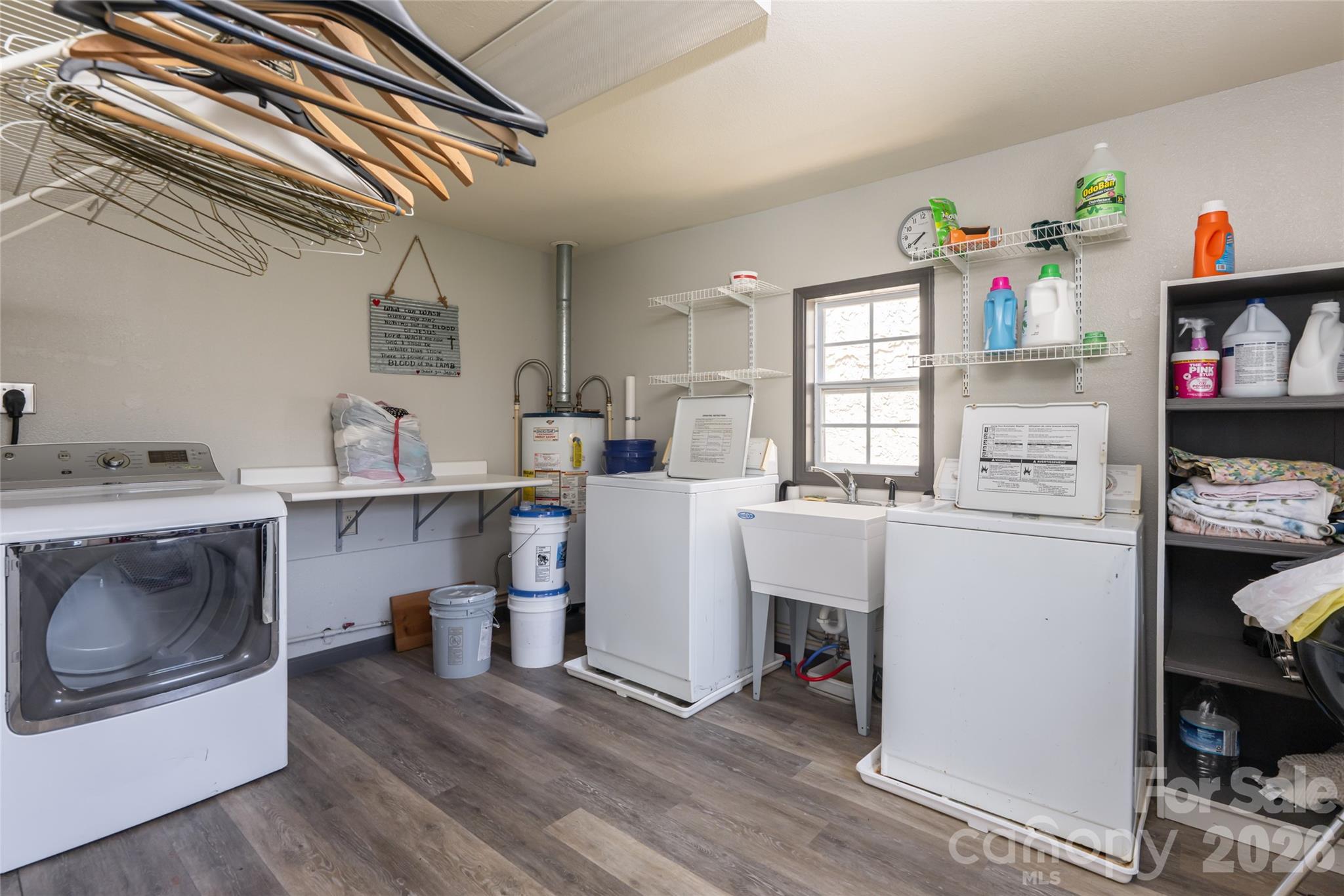 2800 Coxe Road Tryon, NC 28782 - Photo 36 of 40 a utility room with cabinets dryer and washer