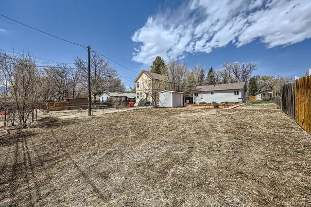 a view of a town with snow on the road