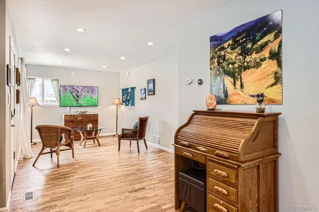 a view of a dining room with furniture window and wooden floor