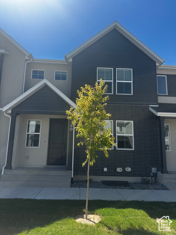 80 South Moonlit Road Mapleton, UT 84664 - Photo 1 of 18 View of front of home featuring a front yard, a porch, and stucco siding