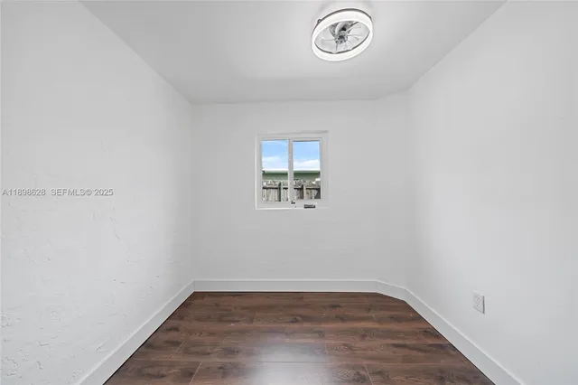 a view of a livingroom with wooden floor