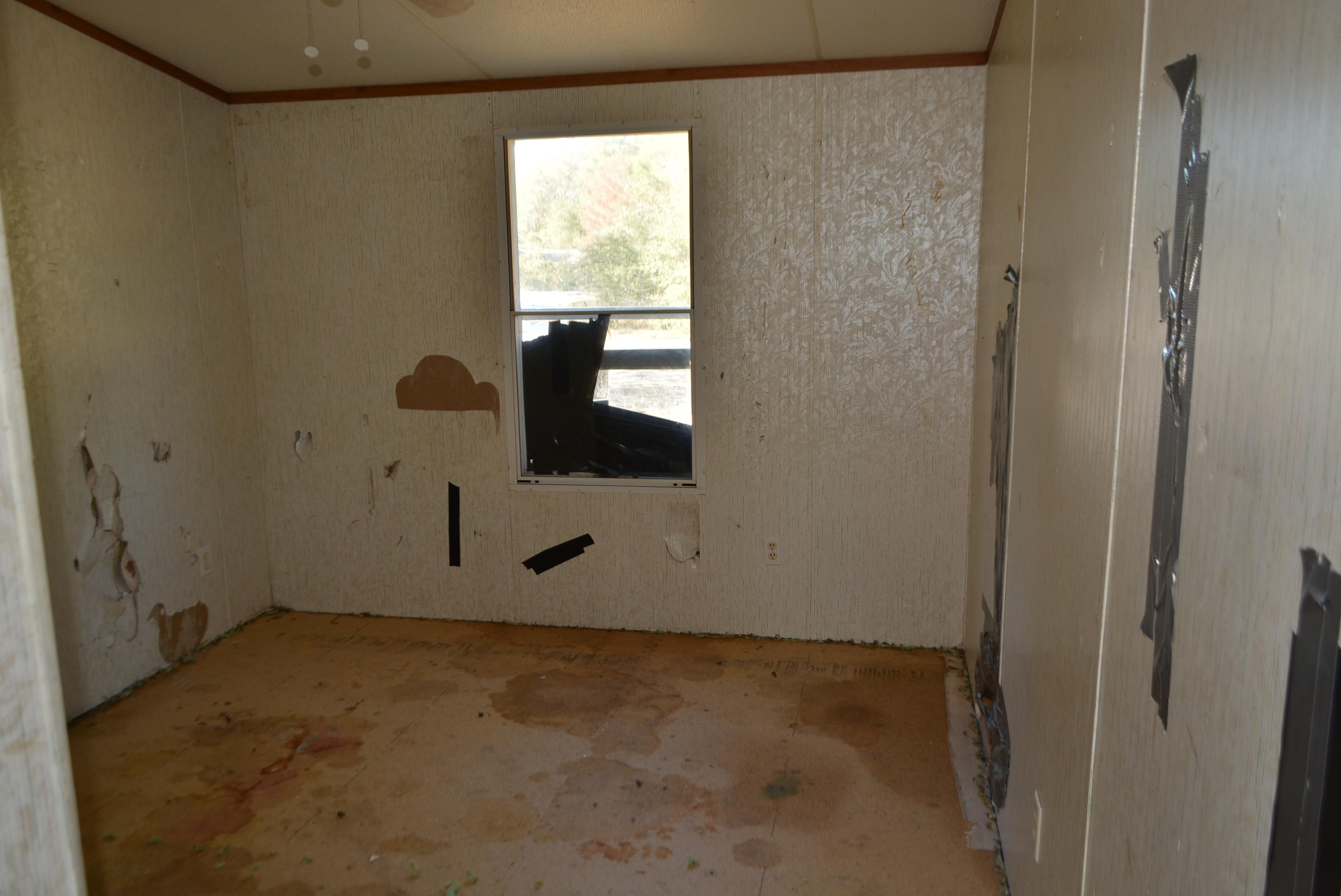 197 Ranger Road DeFuniak Springs, FL 32433 - Photo 10 of 16 a view of an empty room with a window