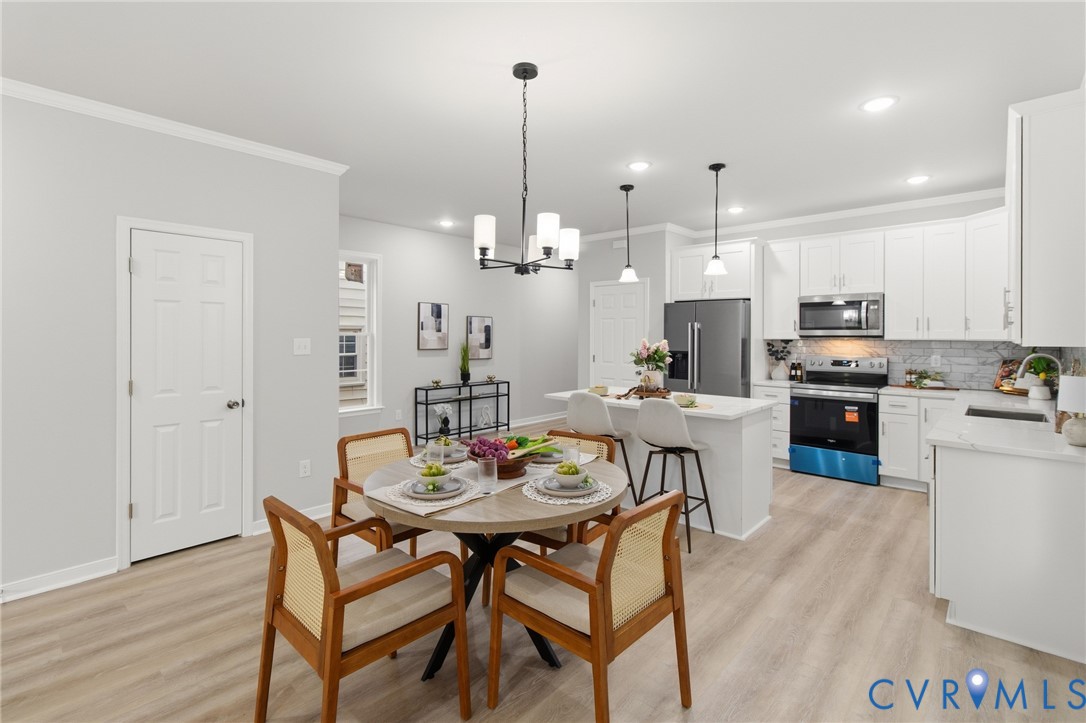1430 Decatur Street Richmond, VA 23224 - Photo 10 of 37 Open-concept kitchen and dining area featuring lig