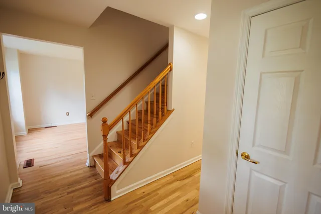 a view of an entryway with wooden floor