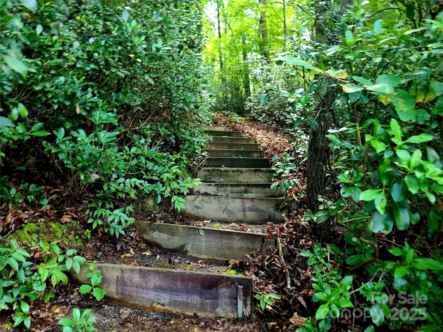 a view of a garden with sitting area