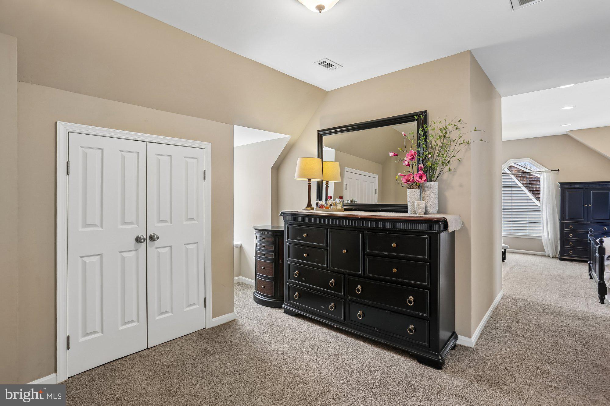9 Midsummer Court Gaithersburg, MD 20878 - Photo 34 of 69 a room with a dresser and a mirror on dresser