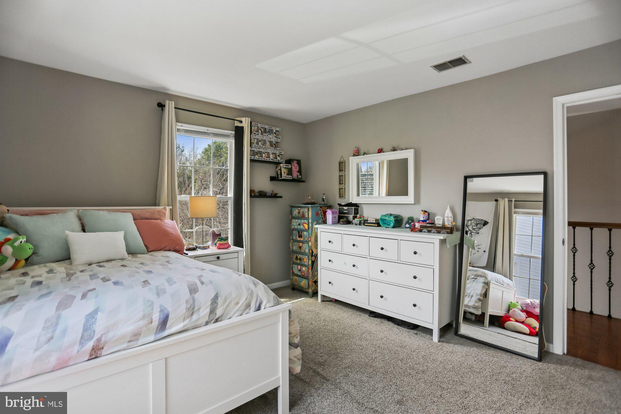 9 Midsummer Court Gaithersburg, MD 20878 - Photo 41 of 69 a bedroom with a bed and a dresser in it