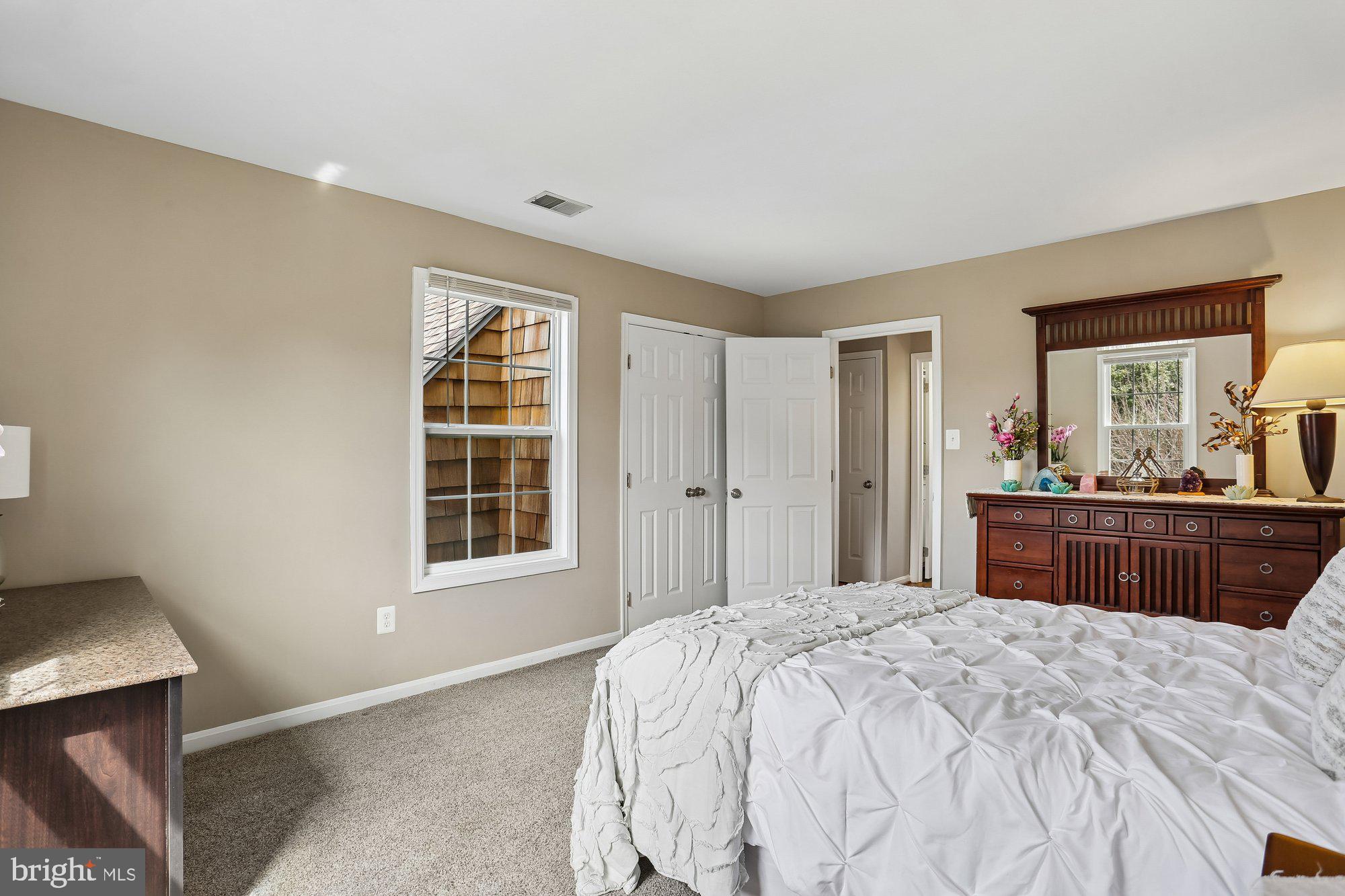 9 Midsummer Court Gaithersburg, MD 20878 - Photo 50 of 69 a bedroom with a large bed and a dresser