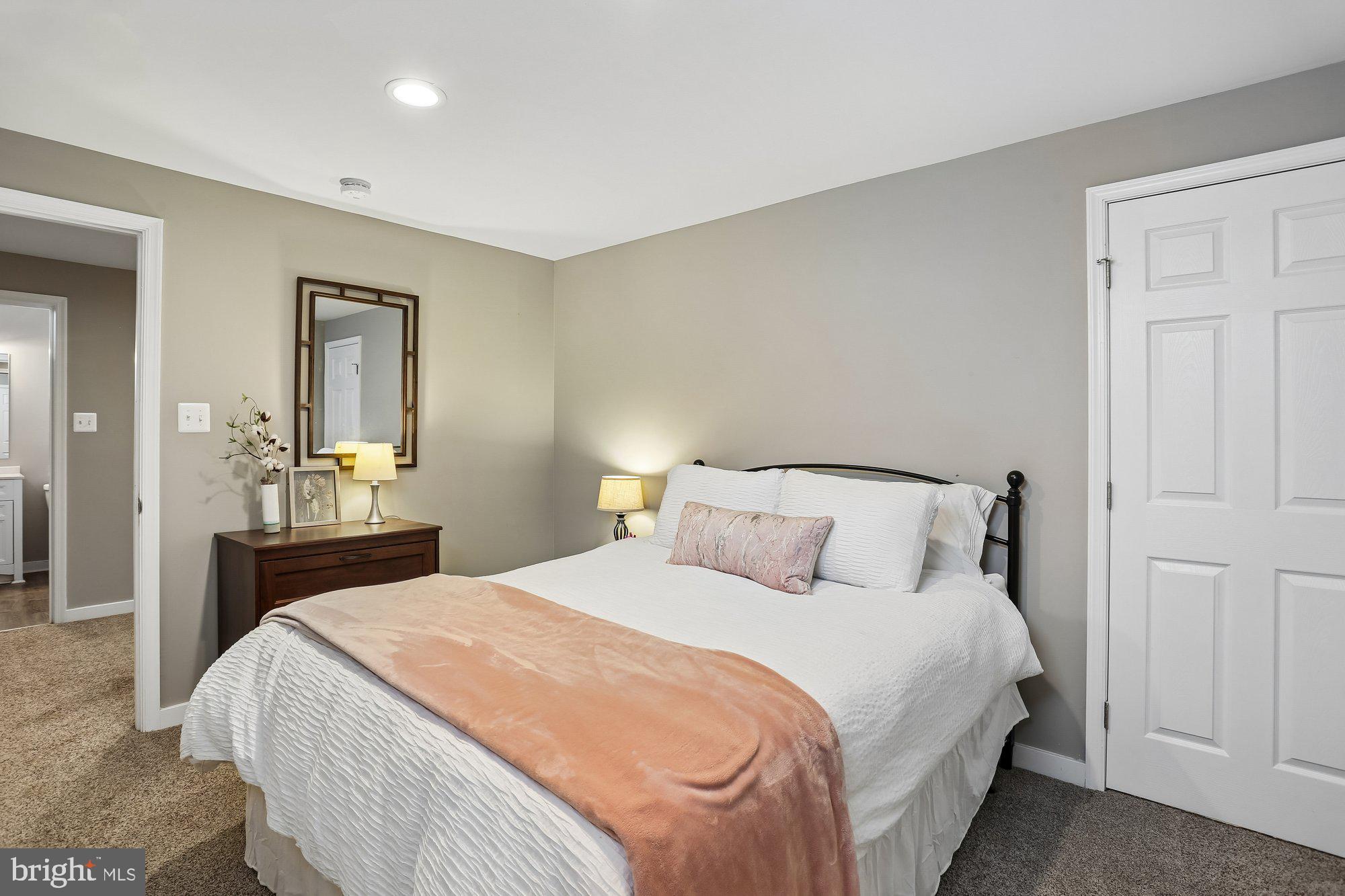 9 Midsummer Court Gaithersburg, MD 20878 - Photo 62 of 69 a bedroom with a bed and a mirror