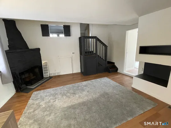 a bedroom with a bed and a television