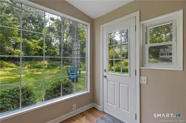 a view of a door and a window