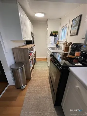 a kitchen with a stove and a refrigerator