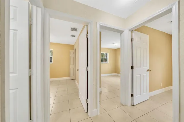a view of a bathroom with a shower and a sink
