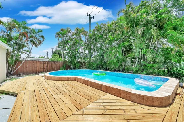 a view of swimming pool with seating space