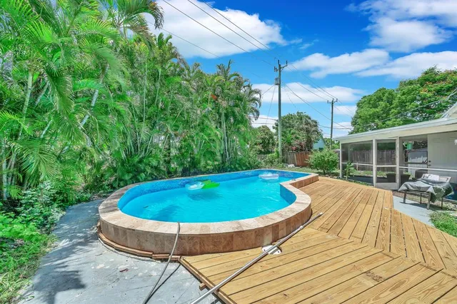 a view of swimming pool with seating space