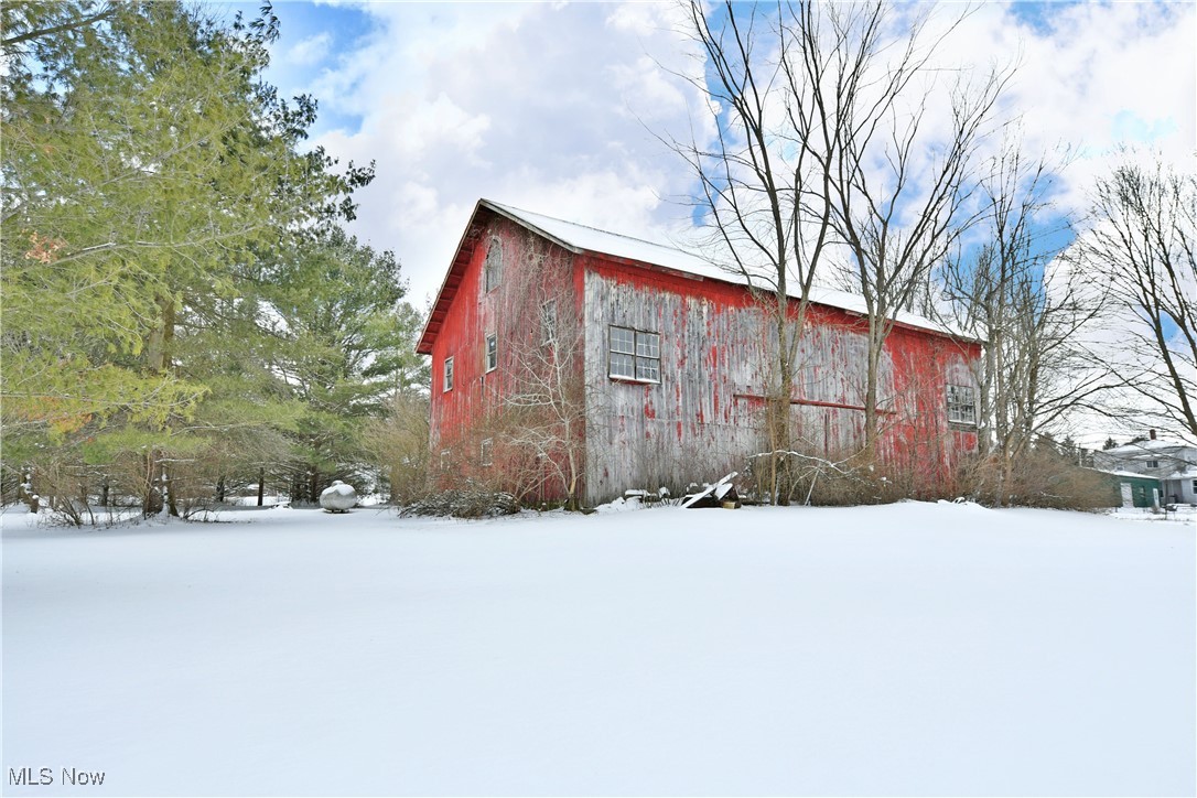 3339 Bushnell Campbell Road Fowler, OH 44418 - Photo 47 of 50 Snow covered structure featuring an outbuilding and a barn