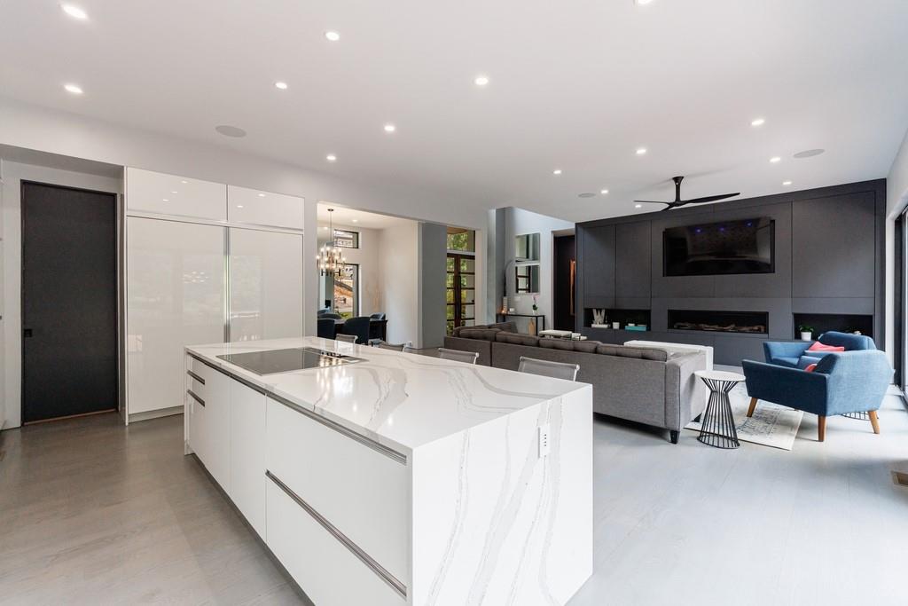 4036 Statewood Road Northeast Atlanta, GA 30342 - Photo 15 of 84 a large kitchen with kitchen island a sink table and chairs