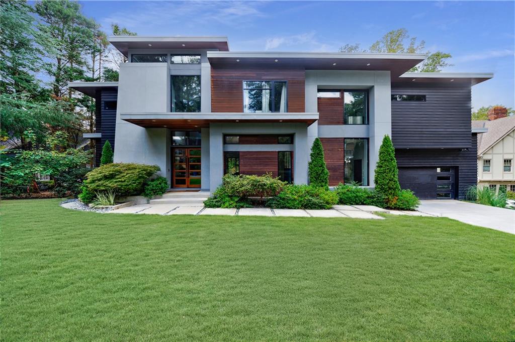 4036 Statewood Road Northeast Atlanta, GA 30342 - Photo 2 of 84 a view of a house with a yard